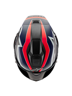 Casco Alpinestars Supertech R10 Team, vista dall'alto, carbonio nero con grafiche rosso fluo e blu opaco, design della calotta aerodinamico con prese d'aria superiori e audaci accenti racing