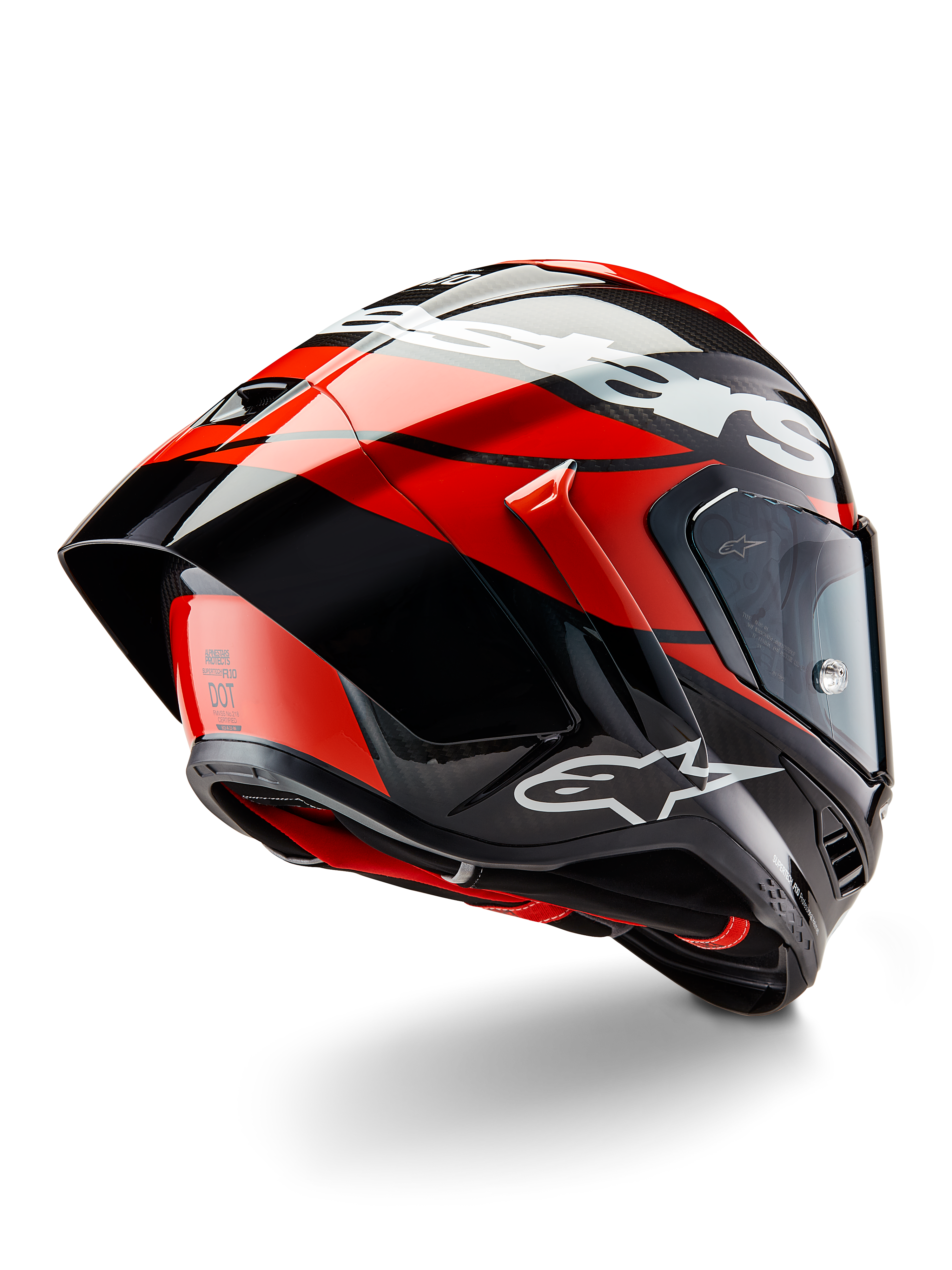 Casco Alpinestars Supertech R10 Element, carbonio nero, rosso vivace e bianco lucido, vista posteriore a tre quarti con ampio spoiler aerodinamico e calotta in fibra di carbonio, loghi Alpinestars in evidenza e certificazione DOT