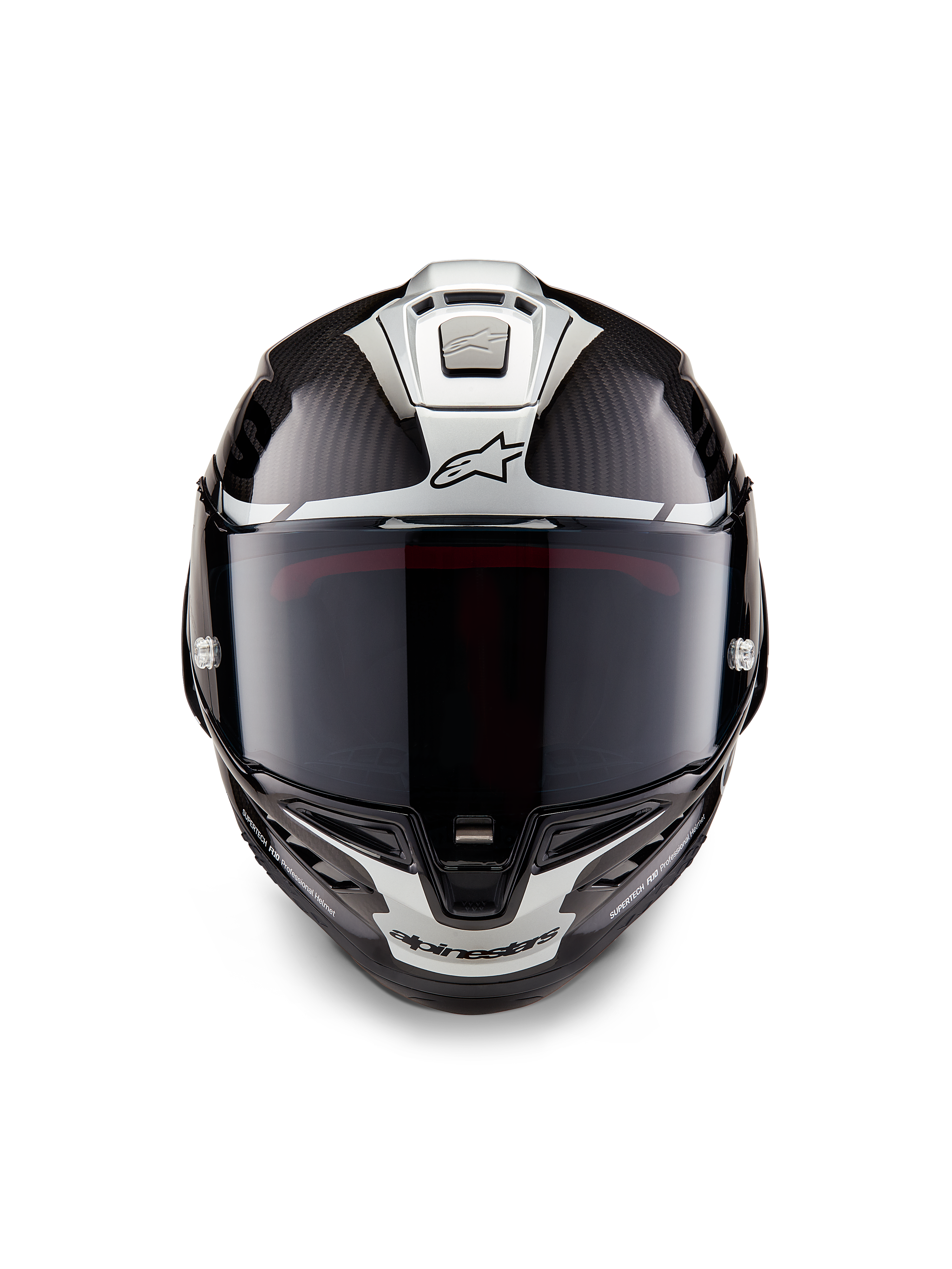 Casco Alpinestars Supertech R10 Element, casco integrale da corsa, nero carbonio e argento lucido, vista frontale con visiera fumé scura, trama in fibra di carbonio lucida, grafiche aerodinamiche argento e loghi Alpinestars