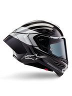 Casco Alpinestars Supertech R10 Element, casco moto integrale racing, finitura in carbonio nero, argento e nero lucido, vista laterale con calotta aerodinamica in fibra di carbonio, visiera trasparente e logo Alpinestars evidente