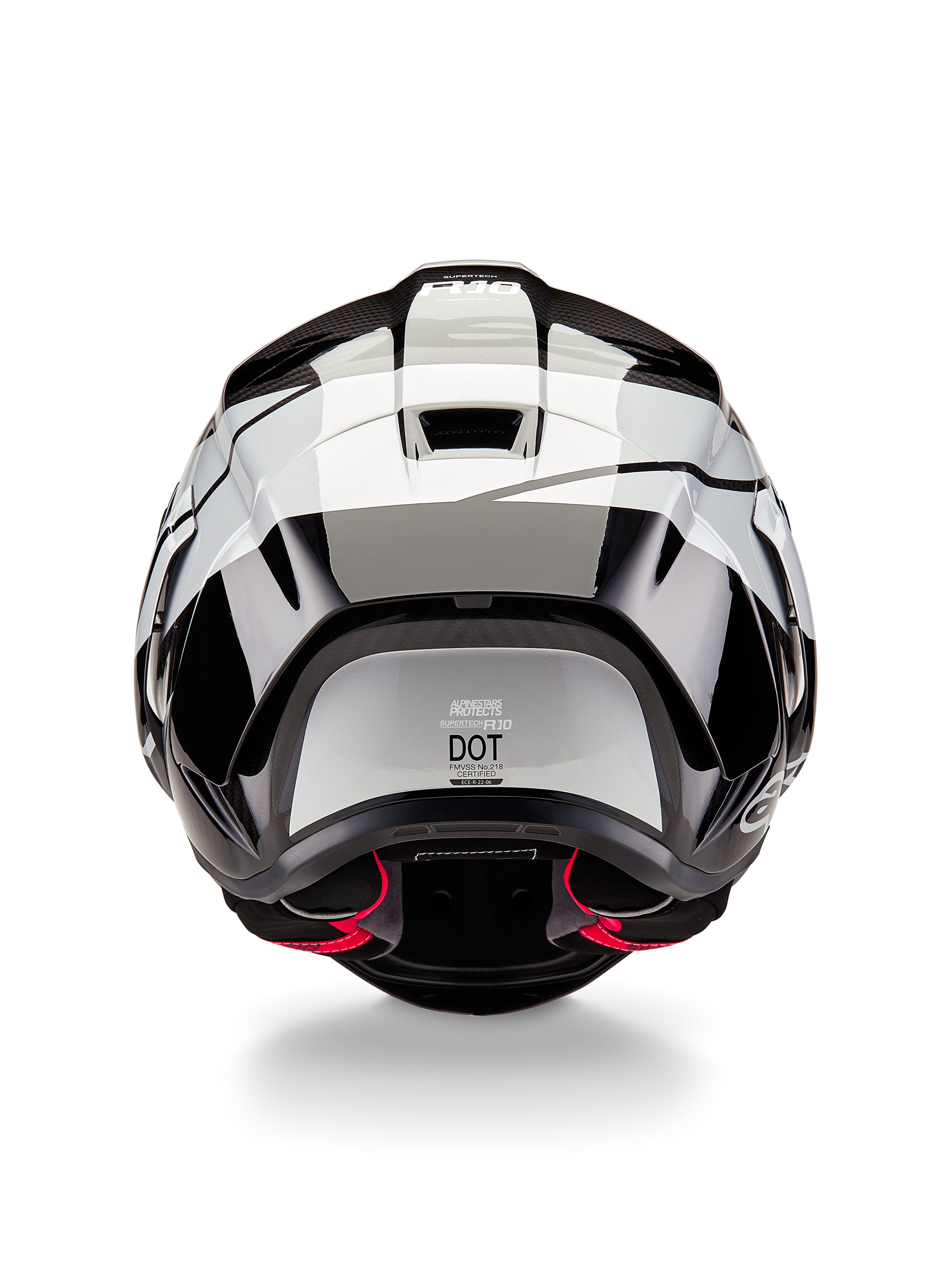 Casco Alpinestars Supertech R10 Element, vista posteriore, nero carbonio argento e nero lucido, con design dello spoiler aerodinamico, etichetta di certificazione DOT e accenti rossi nell'imbottitura interna, protezione per la testa professionale da corsa