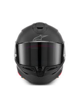 Casco Alpinestars S-R7 Solid, casco integrale da moto in Black Matte, vista frontale con calotta aerodinamica, visiera scura, prese d'aria integrate su mento e parte superiore e logo Astar sulla fronte.