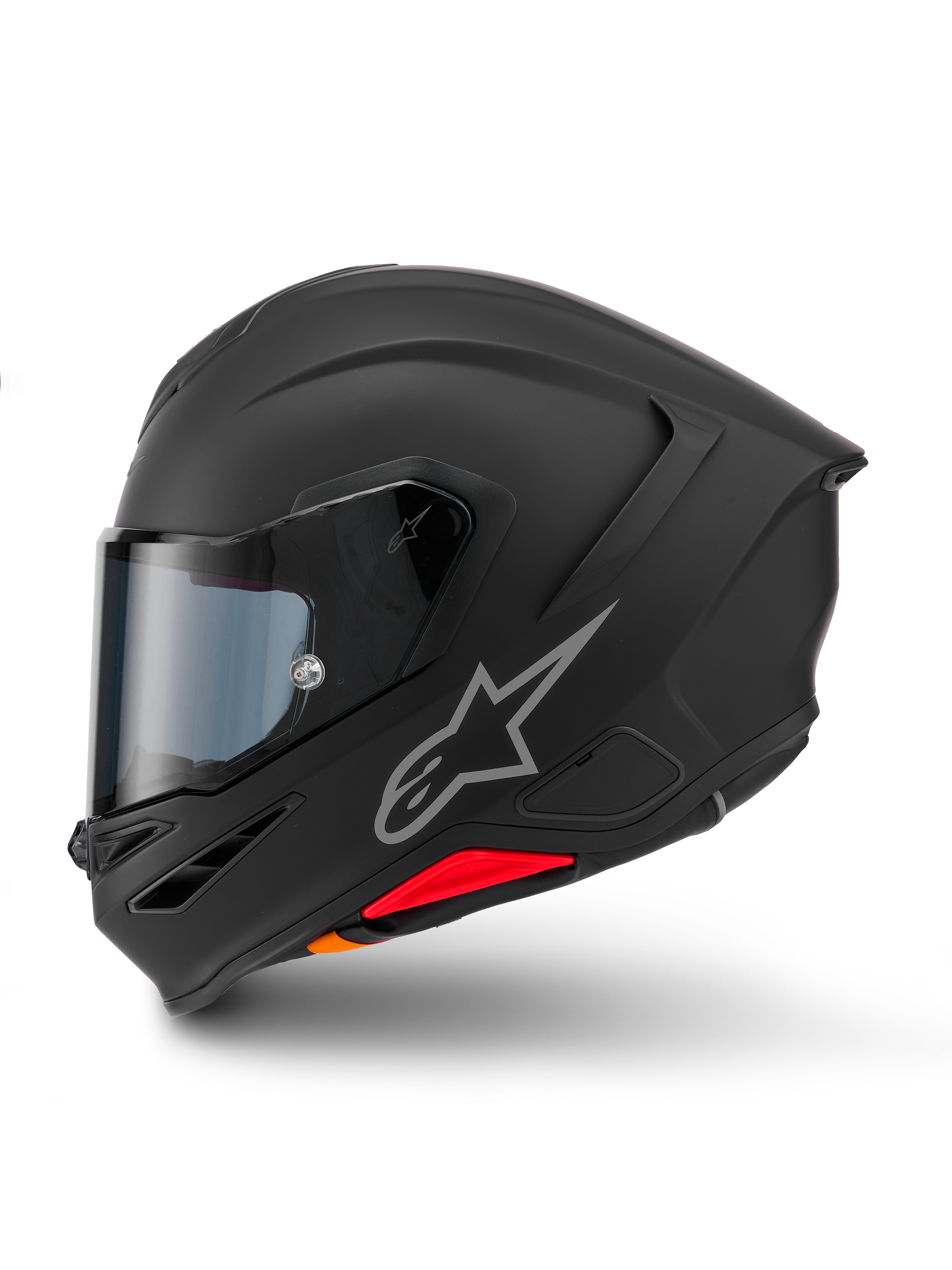 Casco Alpinestars S-R7 Solid, casco integrale da moto, nero opaco, vista laterale, con logo Astars argentato sul lato, design aerodinamico con spoiler integrato e prese d'aria sulla mentoniera, e accenti rossi e arancioni alla base.