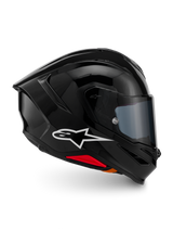 Casco Alpinestars S-R7 Solid, casco integrale da moto, nero lucido, vista laterale con logo Alpinestars bianco, calotta aerodinamica con spoiler integrato e accenti rossi alla base, progettato per prestazioni racing e sportive.