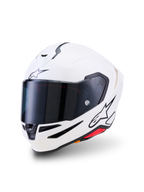 Casco Alpinestars S-R7 Solid, casco integrale da moto, bianco lucido, visiera fumo scuro, logo a stella nero sulla fronte e sul lato, calotta aerodinamica con prese di ventilazione e dettagli rossi, equipaggiamento ad alte prestazioni per pista e strada