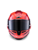 Casco Alpinestars Supertech R10 Arius, casco integrale racing, rosso con accenti bianchi e neri, vista frontale con visiera fumé scuro, con logo Alpinestars su fronte e mentoniera, finitura lucida con prese d'aria aerodinamiche