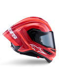 Casco Alpinestars Supertech R10 Arius, casco integrale racing, rosso e arancione lucido, vista laterale con spoiler posteriore aerodinamico, logo Astars bianco sulla mentoniera e visiera trasparente, progettato per prestazioni in pista ad alta velocità