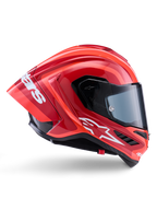 Casco Alpinestars Supertech R10 Arius, casco integrale racing, rosso e arancione lucido, vista laterale con spoiler posteriore aerodinamico, logo Astars bianco sulla mentoniera e visiera trasparente, progettato per prestazioni in pista ad alta velocità