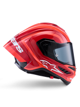 Casco Alpinestars Supertech R10 Arius, casco integrale racing, rosso e arancione lucido, vista laterale con spoiler posteriore aerodinamico, logo Astars bianco sulla mentoniera e visiera trasparente, progettato per prestazioni in pista ad alta velocità