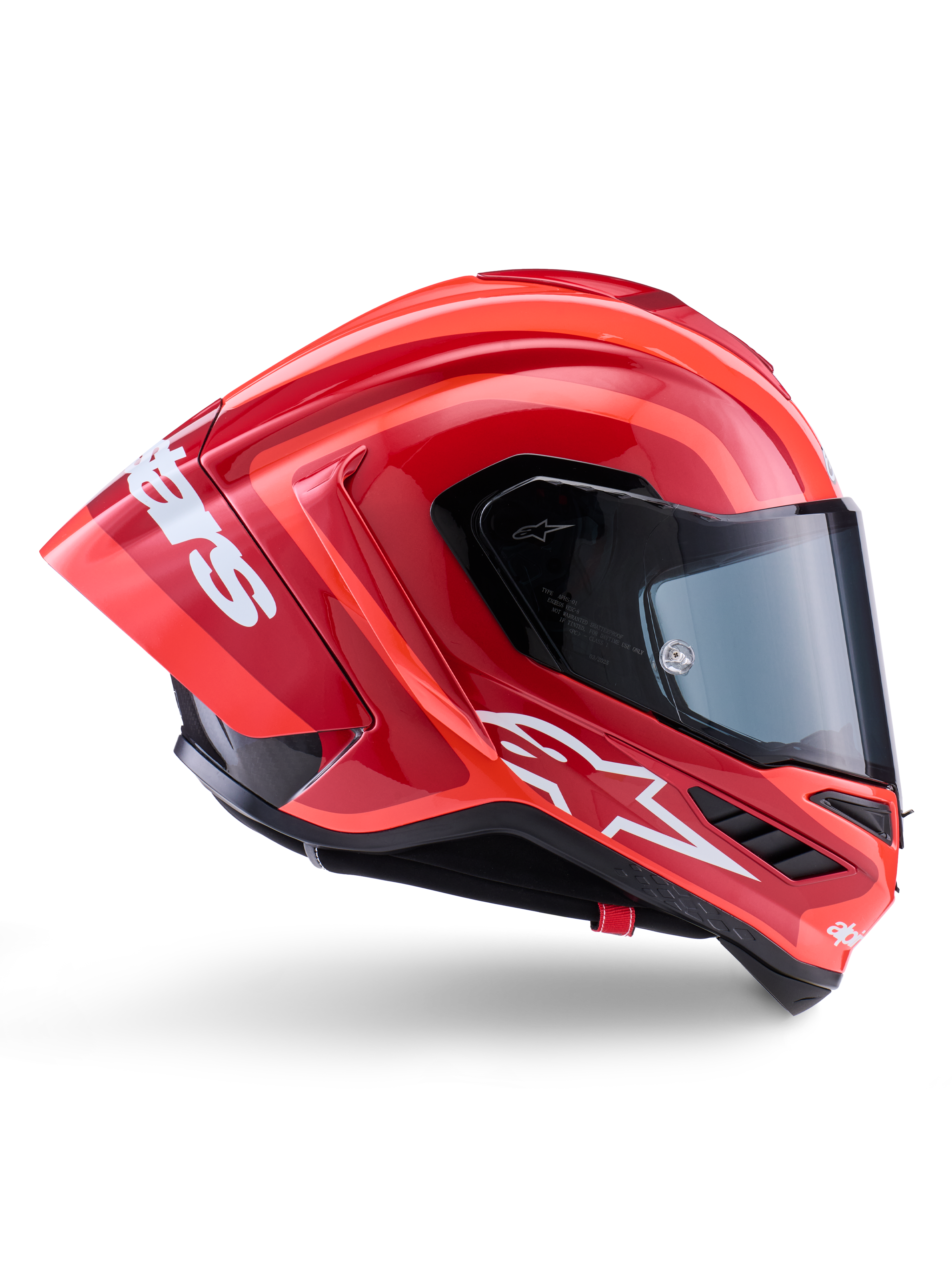 Casco Alpinestars Supertech R10 Arius, casco integrale racing, rosso e arancione lucido, vista laterale con spoiler posteriore aerodinamico, logo Astars bianco sulla mentoniera e visiera trasparente, progettato per prestazioni in pista ad alta velocità