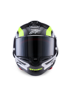 Casco Alpinestars Supertech R10 Arius, casco da moto racing, nero argento e giallo fluo lucido, vista frontale con calotta in fibra di carbonio, visiera scura e sistema di ventilazione integrato.