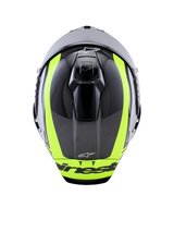 Casco Alpinestars Supertech R10 Arius, vista dall'alto, Nero Argento e Giallo Fluo Lucido, calotta in fibra di carbonio con vivaci strisce giallo fluorescente, prese d'aria superiori aerodinamiche e logo Alpinestars, casco racing ad alte prestazioni