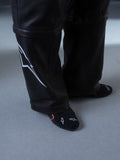 Alpinestars RSRV Starline Shoes, scarpe lifestyle premium, nere con dettagli bianchi e rossi, design elegante con texture liscia