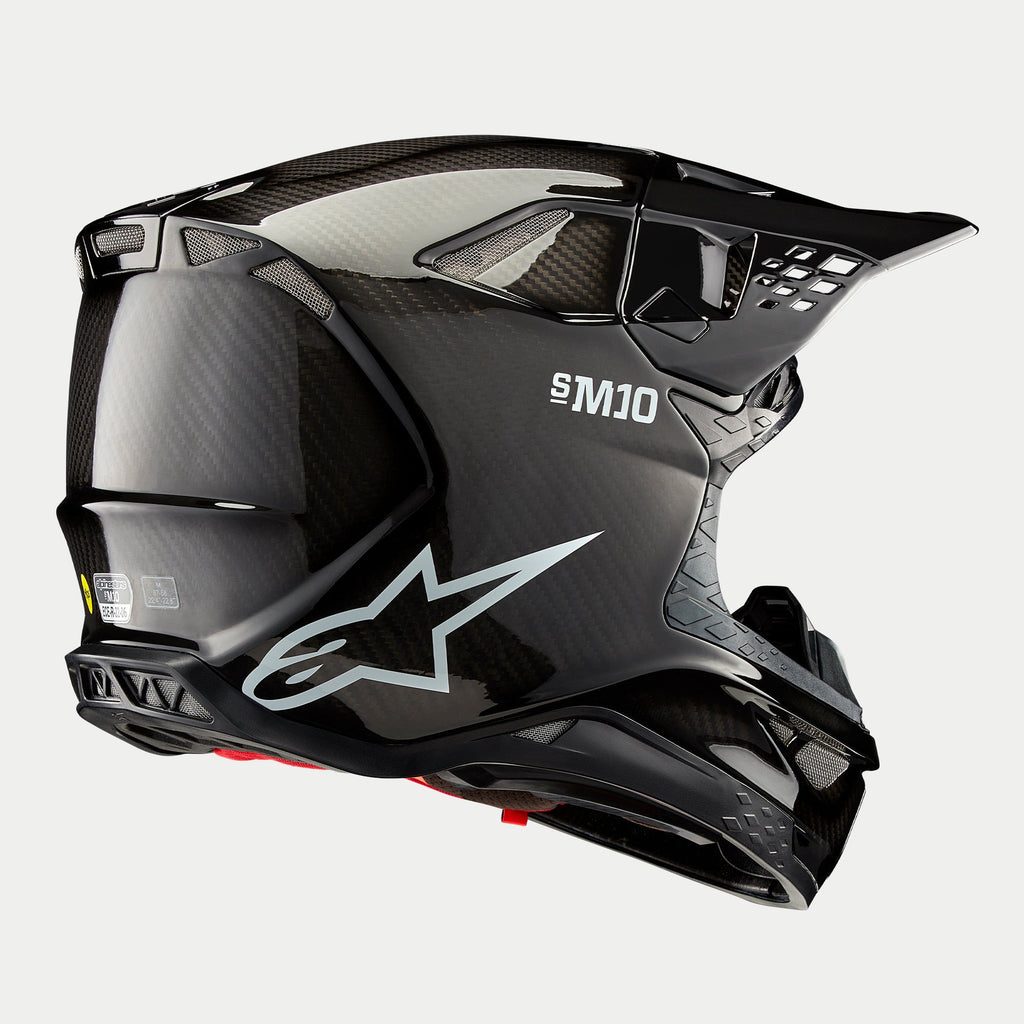 Casco Alpinestars Supertech M10 Solid, casco da motocross, finitura in carbonio nero lucido, con logo Astars bianco e marchio S-M10, calotta aerodinamica con trama in fibra di carbonio a vista e diverse porte di ventilazione