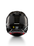 Alpinestars Supertech M10 Solid ECE 22.06, casco da motocross in carbonio nero lucido, vista posteriore con grafiche bianche, prese d’aria ed etichette MIPS ed ECE-R 22.06