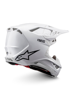 Alpinestars Casco Supertech M10 Solid ECE 22.06, casco da motocross bianco lucido con grafiche nere, dettagli rossi, prese d’aria e visiera parasole