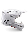 Alpinestars Casco Supertech M10 Solid ECE 22.06, casco da motocross bianco lucido con logo nero, visiera parasole e design integrale ventilato, vista laterale