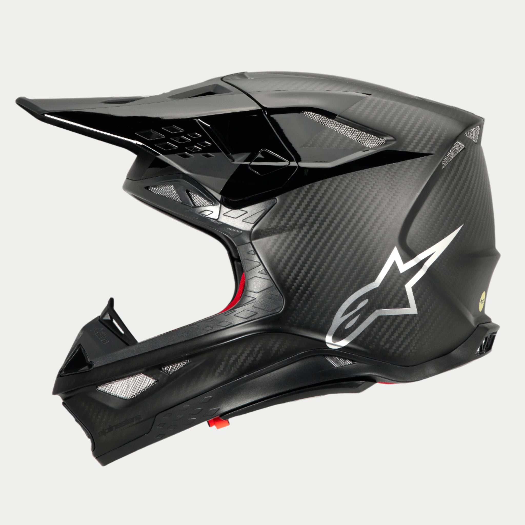 Casco Alpinestars Supertech M10 Fame ECE 22.06, vista di profilo, finitura in carbonio nero opaco e lucido, con trama in fibra di carbonio a vista, logo Astars argento sul lato, design aerodinamico con prese d'aria integrate e visiera nera