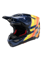 Casco Alpinestars Supertech M10 TLD Edition 25, casco da motocross, blu scuro lucido con grafiche arancioni e giallo fluo, imbottitura interna rossa, calotta aerodinamica con numerose prese d'aria, logo Troy Lee Designs sulla visiera, equipaggiamento professionale per fuoristrada