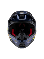 Casco Alpinestars Supertech M10 TLD Edition 25, casco da motocross, blu scuro metallizzato lucido con imbottitura interna rossa, vista frontale con rete di ventilazione e grafiche laterali in giallo e arancione, protezione premium per competizioni off-road