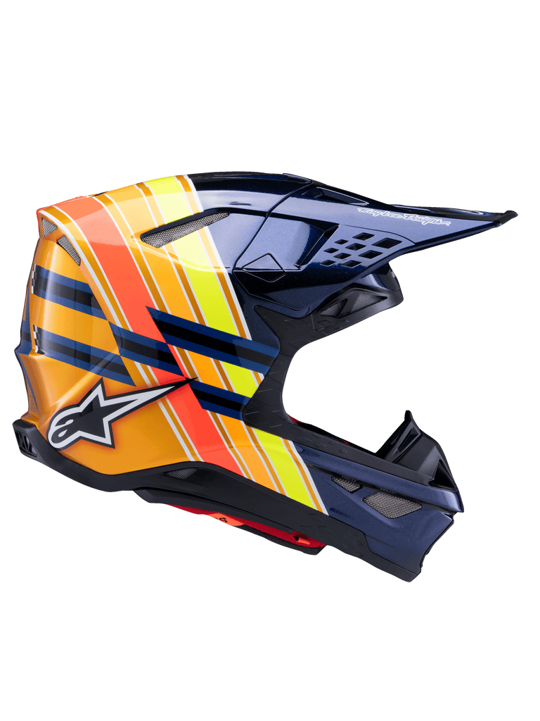 Casco Alpinestars Supertech M10 TLD Edition 25, casco da motocross, blu metallizzato scuro con vivaci strisce arancioni, gialle e rosse, vista laterale di profilo, finitura lucida con branding Alpinestars e Troy Lee Designs, calotta aerodinamica con molteplici prese d'aria a rete per gare fuori strada