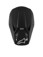 Casco Alpinestars S-M3 Solid, casco da motocross, nero opaco, vista dall'alto che mostra la finitura opaca e la calotta aerodinamica, con logo a stella Alpinestars bianco sulla visiera e marchio SM3, protezione premium per la testa per corse off-road