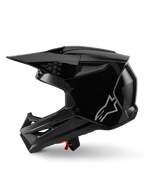 Casco Alpinestars S-M3 Solid, casco da motocross, nero lucido, vista laterale, logo Alpinestars argento, visiera aerodinamica e diverse prese d'aria per corse off-road
