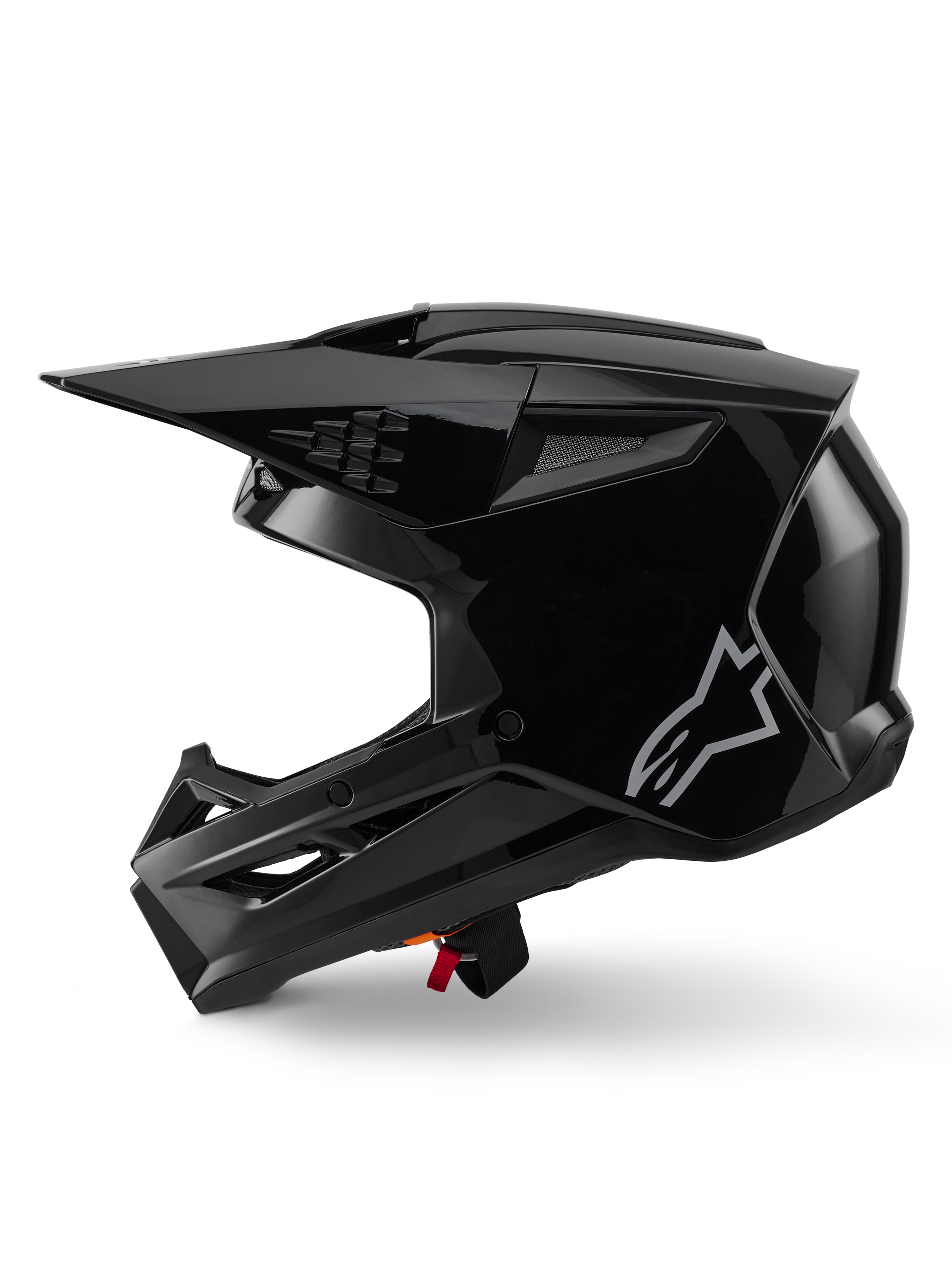 Casco Alpinestars S-M3 Solid, casco da motocross, nero lucido, vista laterale, logo Alpinestars argento, visiera aerodinamica e diverse prese d'aria per corse off-road