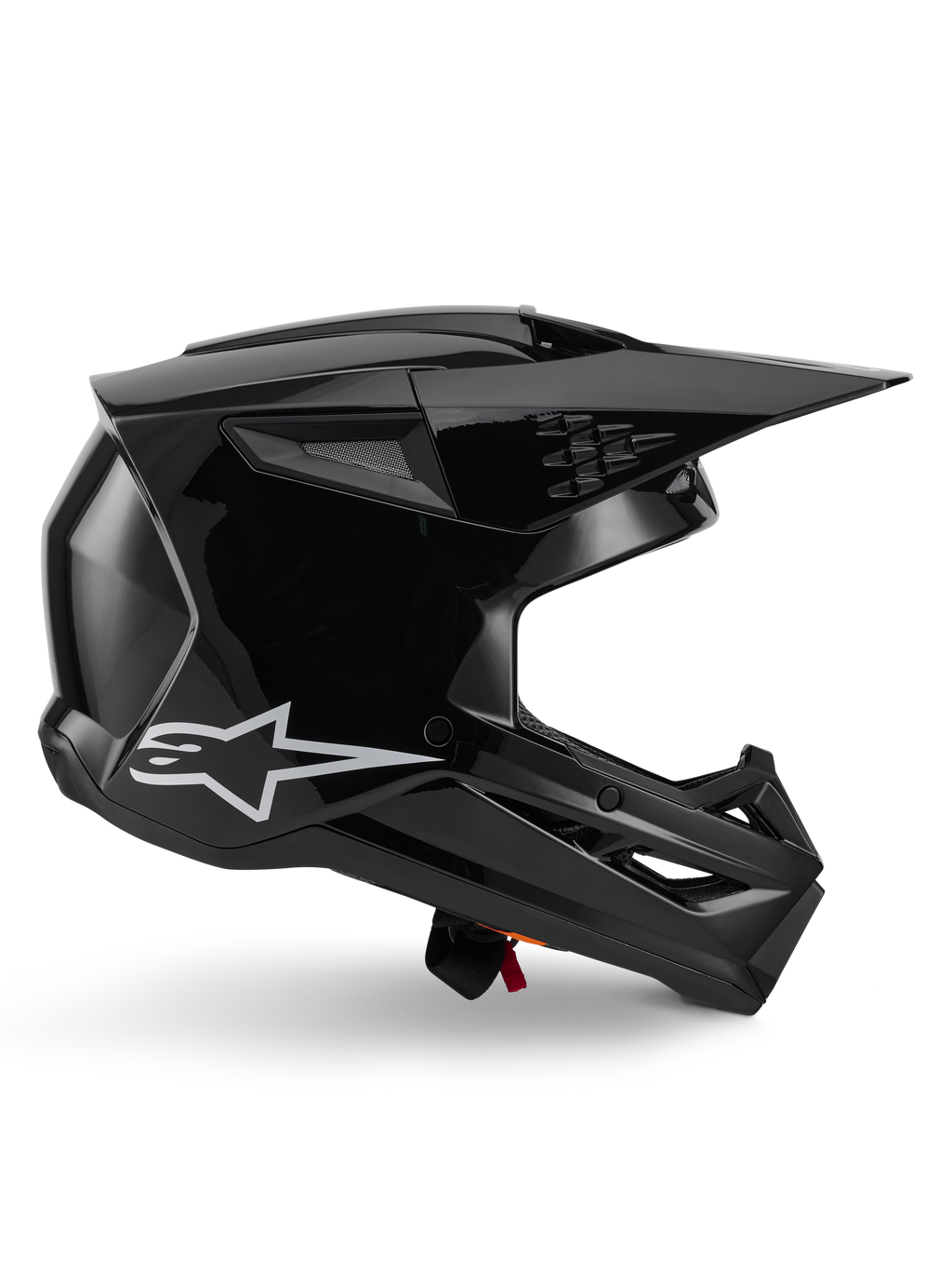 Alpinestars S-M3 Solid Helmet, casco da motocross, nero lucido, vista laterale con logo a stella bianca, design aerodinamico angolare con prese d'aria in mesh e visiera, equipaggiamento protettivo per il fuoristrada