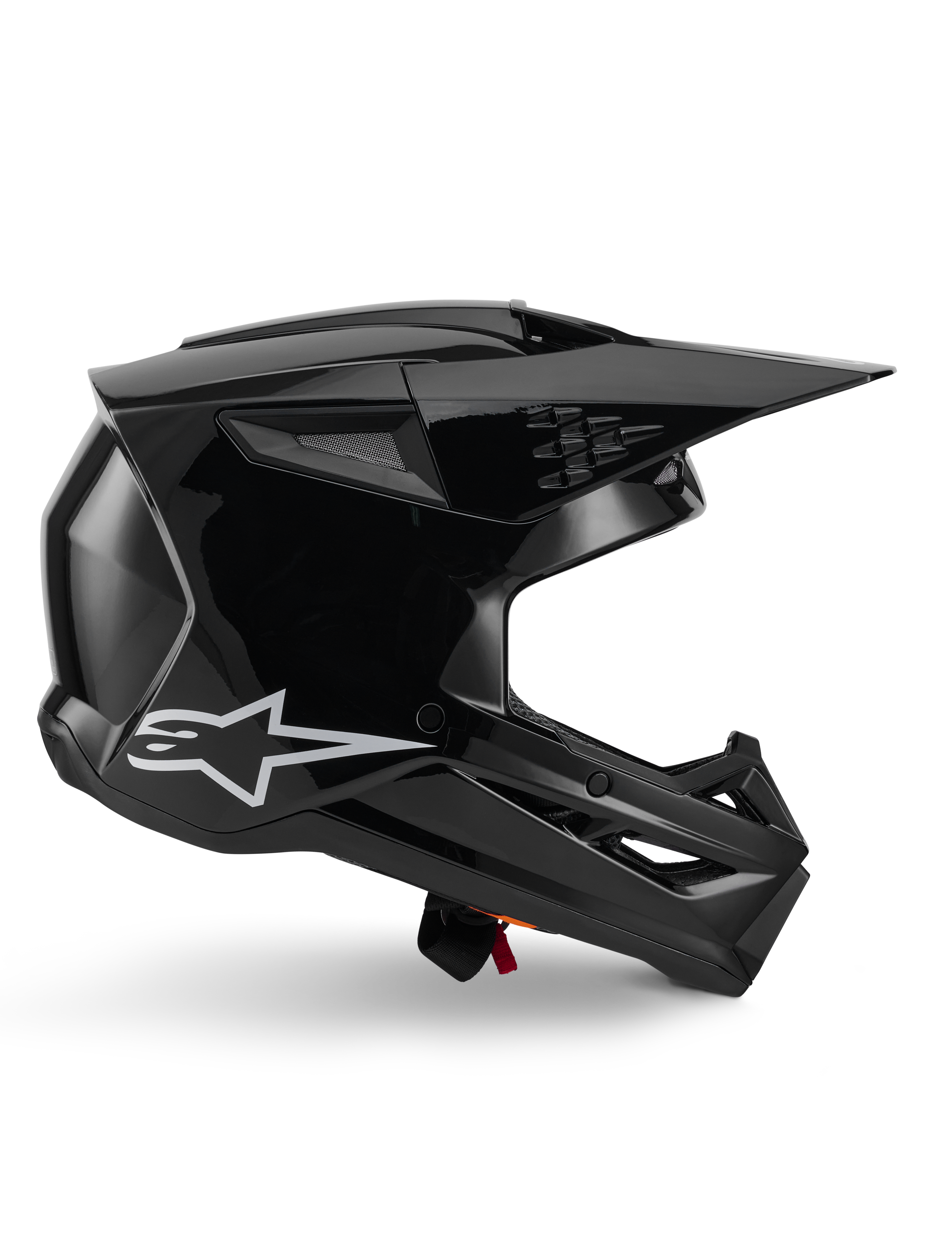 Alpinestars S-M3 Solid Helmet, casco da motocross, nero lucido, vista laterale con logo a stella bianca, design aerodinamico angolare con prese d'aria in mesh e visiera, equipaggiamento protettivo per il fuoristrada