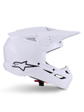 Casco Alpinestars S-M3 Solid, casco da motocross, bianco lucido, vista di profilo laterale con logo a stella nero, calotta aerodinamica angolare, prese d'aria multiple, visiera e mentoniera integrate, protezione per competizioni fuoristrada