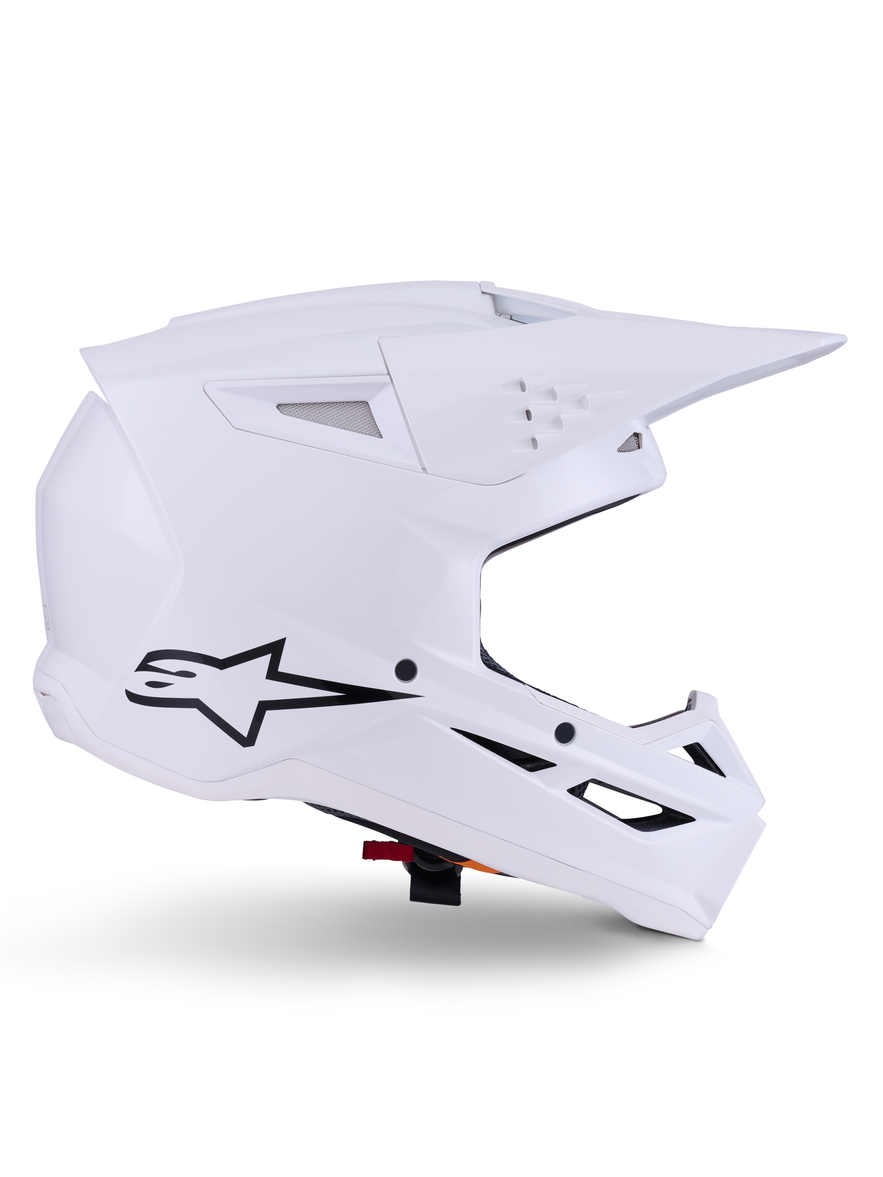 Casco Alpinestars S-M3 Solid, casco da motocross, bianco lucido, vista di profilo laterale con logo a stella nero, calotta aerodinamica angolare, prese d'aria multiple, visiera e mentoniera integrate, protezione per competizioni fuoristrada
