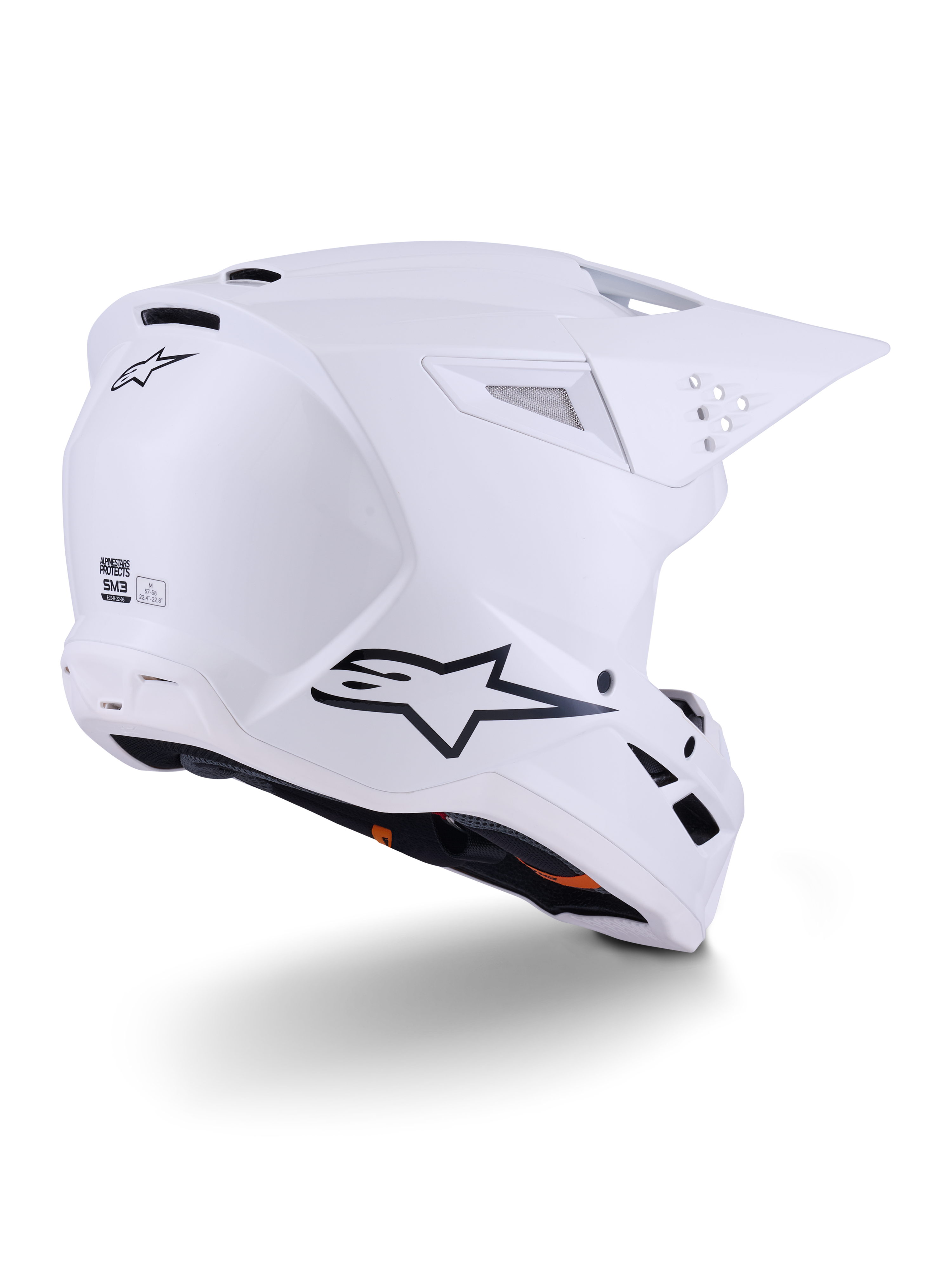 Casco Alpinestars S-M3 Solid, casco da motocross, bianco lucido, vista posteriore a tre quarti che mostra il logo Alpinestars nero, prese d'aria e design aerodinamico della calotta per gare off-road