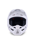 Casco Alpinestars S-M3 Solid ECE 22.06, casco da motocross, bianco lucido, vista frontale con molteplici prese d'aria sulla mentoniera e sulla fronte, calotta aerodinamica con visiera, marchio 'ONE GOAL - ONE VISION' e fodera interna in rete per la protezione off-road.