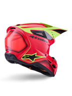 Casco Alpinestars S-M3 Fray ECE 22.06, casco da motocross, rosso giallo fluo nero lucido, vista posteriore di tre quarti che mostra la calotta aerodinamica snella con molteplici prese d'aria, grafiche giallo neon e il logo Alpinestars nero in evidenza.