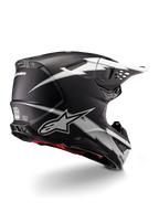 Casco Alpinestars Supertech M10 Ampress, casco da motocross, nero e bianco opaco, con grafiche a fulmini bianchi su calotta nera opaca, vista posteriore a tre quarti che mostra il logo Alpinestars e le prese d'aria