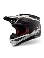 Casco Alpinestars Supertech M10 Ampress, casco da motocross, nero opaco e bianco, con grafiche bianche a forma di fulmine e loghi a stella, fodera interna rossa, calotta in carbonio multi-composito con profilo aerodinamico snello