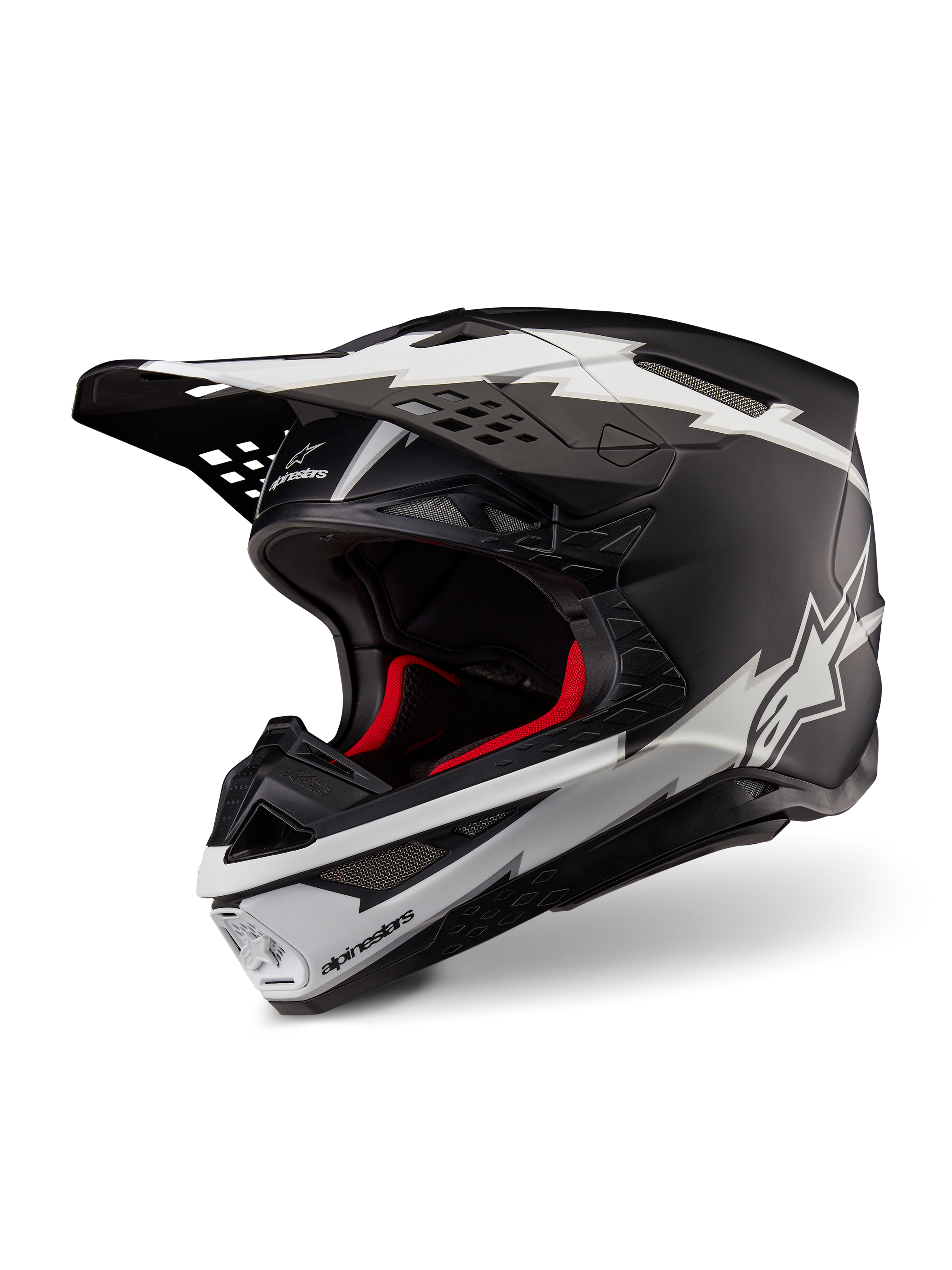 Casco Alpinestars Supertech M10 Ampress, casco da motocross, nero opaco e bianco, con grafiche bianche a forma di fulmine e loghi a stella, fodera interna rossa, calotta in carbonio multi-composito con profilo aerodinamico snello