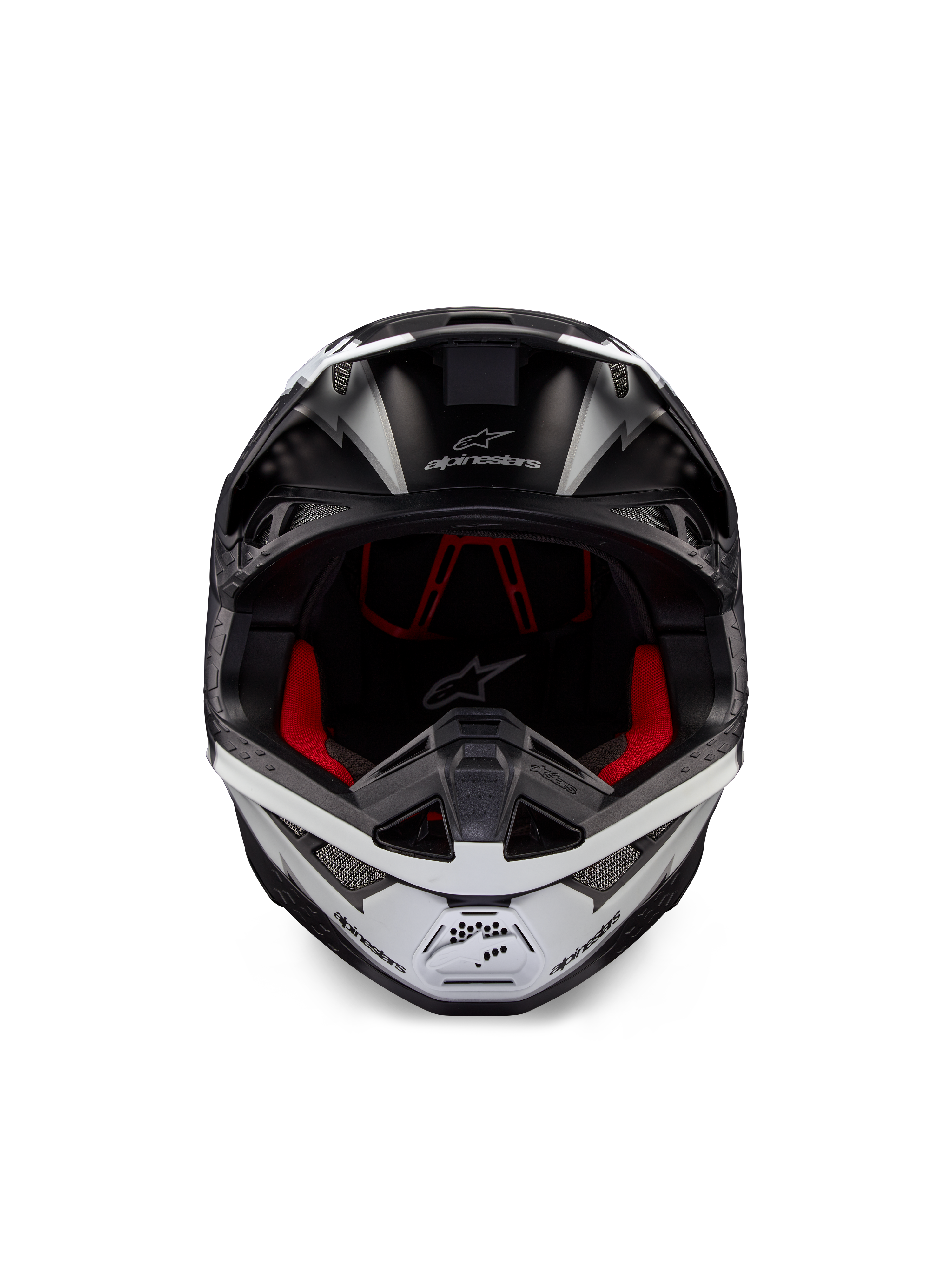 Casco Alpinestars Supertech M10 Ampress, casco da motocross, nero e bianco opaco, vista frontale con rivestimento interno rosso, calotta aerodinamica con porte di ventilazione e logo Alpinestars