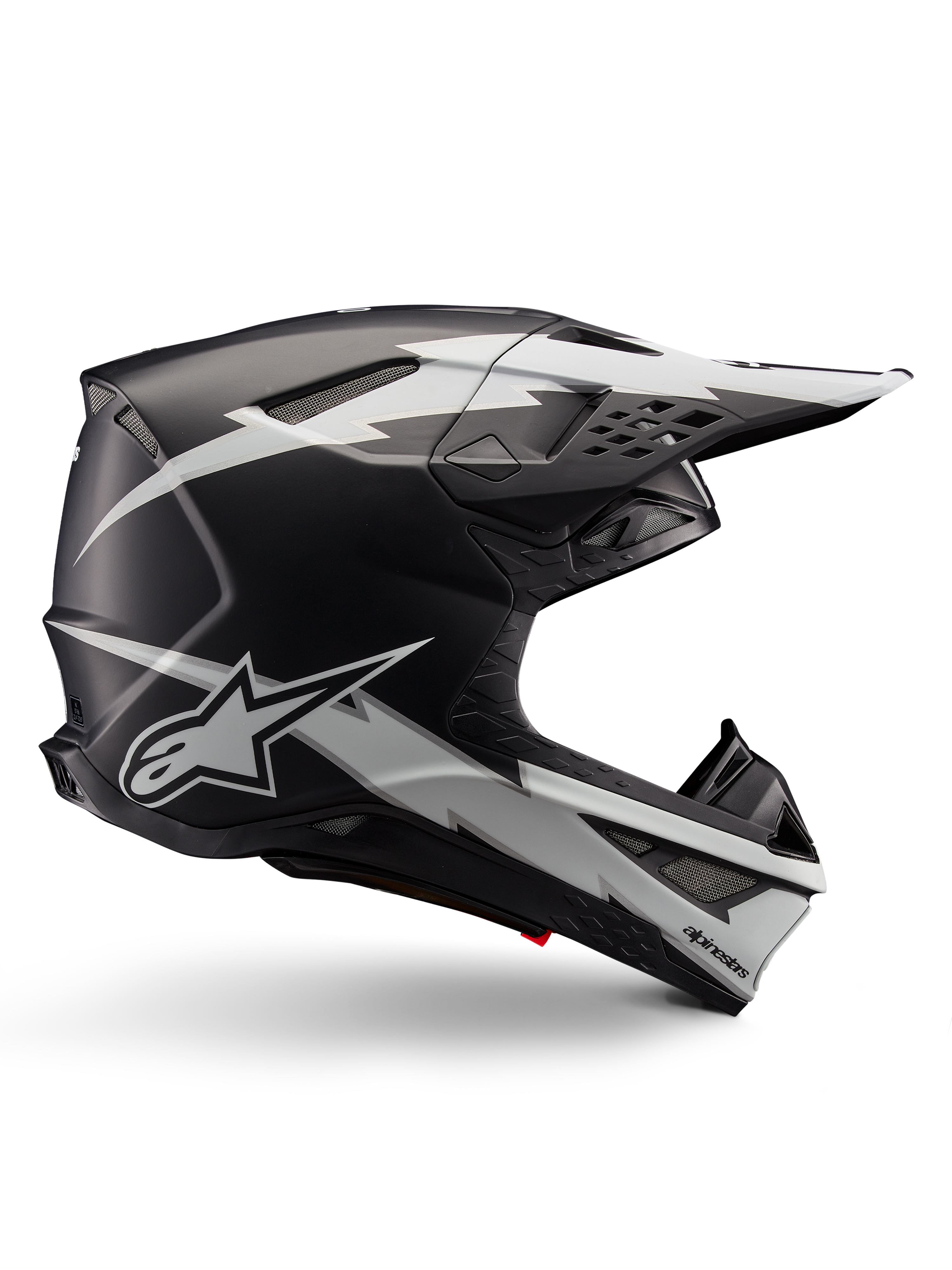 Casco Alpinestars Supertech M10 Ampress, casco da motocross, nero e bianco opaco, profilo aerodinamico con grafiche a fulmine bianco, prese d'aria multiple, visiera parasole estesa, costruzione in fibra di carbonio con finitura opaca