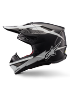 Casco Alpinestars Supertech M10 Ampress, casco da motocross, nero opaco e bianco, vista di profilo con grafiche audaci bianche in stile fulmine, calotta aerodinamica con prese d'aria visibili e visiera, protezione avanzata per il fuoristrada