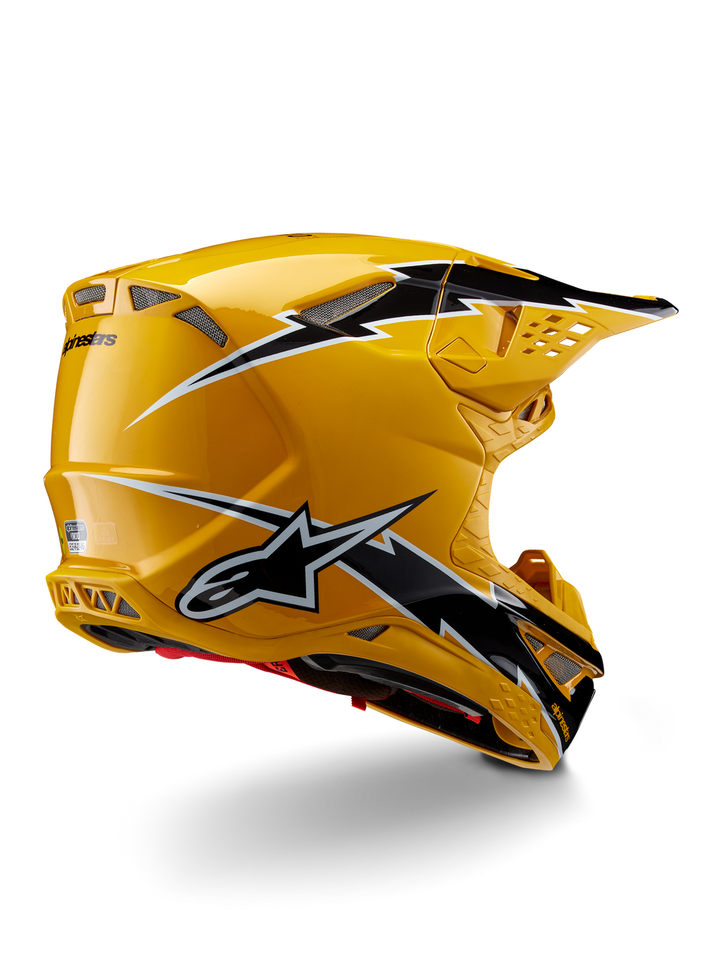 Casco Alpinestars Supertech M10 Ampress, casco da motocross, Nero Giallo Lucido, caratterizzato da una finitura gialla lucida con grafiche stile fulmine nere e bianche, vista posteriore di tre quarti che mostra la calotta aerodinamica e le prese d'aria integrate.