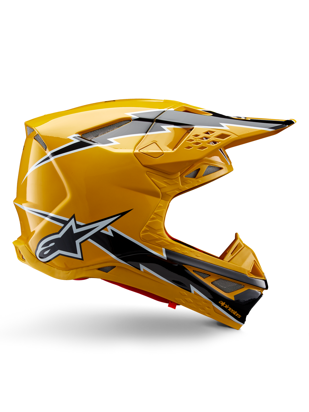Casco Alpinestars Supertech M10 Ampress, casco da motocross, nero e giallo lucido, profilo laterale con grafiche a fulmine nere e bianche, logo a stella Alpinestars, design aerodinamico con porte di ventilazione integrate e visiera regolabile