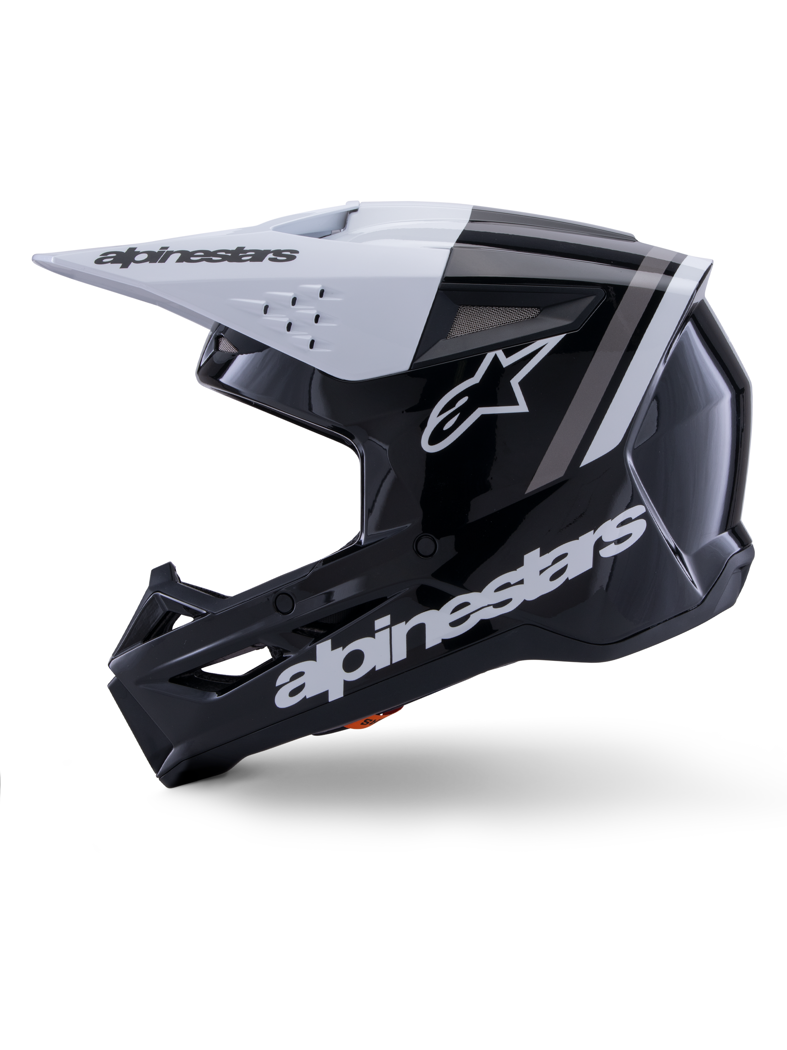Casco Alpinestars S-M3 Radium ECE 22.06, vista laterale, finitura lucida nera e bianca, strisce racing grigie, logo Alpinestars bianco sul lato e sulla zona del mento, design ventilato per motocross ed enduro