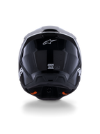 Casco Alpinestars S-M3 Radium ECE 22.06, casco da motocross, nero bianco grigio lucido, vista posteriore che mostra la finitura nera lucida, logo Alpinestars a stella, porte di scarico della ventilazione ed etichetta di certificazione ECE.
