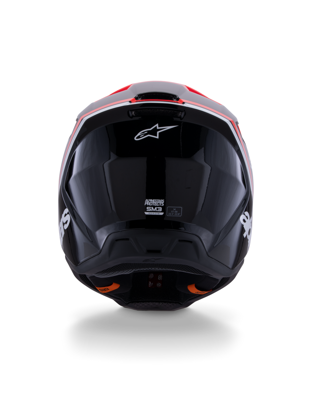 Alpinestars S-M3 Radium Helmet ECE 22.06, casco da motocross, nero lucido con accenti rosso fluo e bianchi, vista posteriore che mostra il design aerodinamico della calotta, logo a stella bianco ed etichette di certificazione.