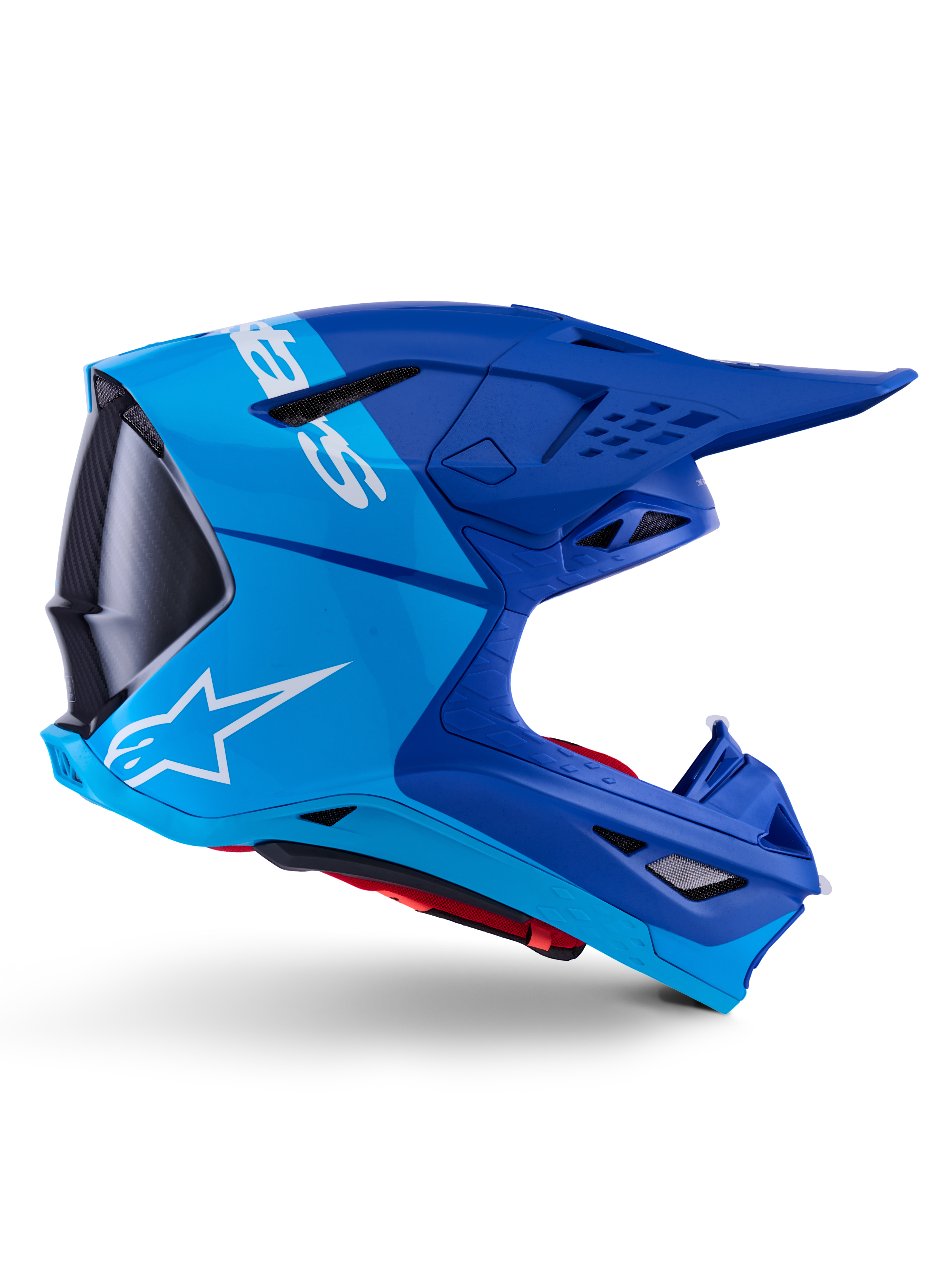 Casco Alpinestars Supertech M10 Flood, casco da motocross, blu metallizzato e blu medio con accenti in carbonio nero, vista laterale, con logo bianco, design aerodinamico con prese di ventilazione, dettagli in fibra di carbonio, protezione professionale per competizioni fuoristrada