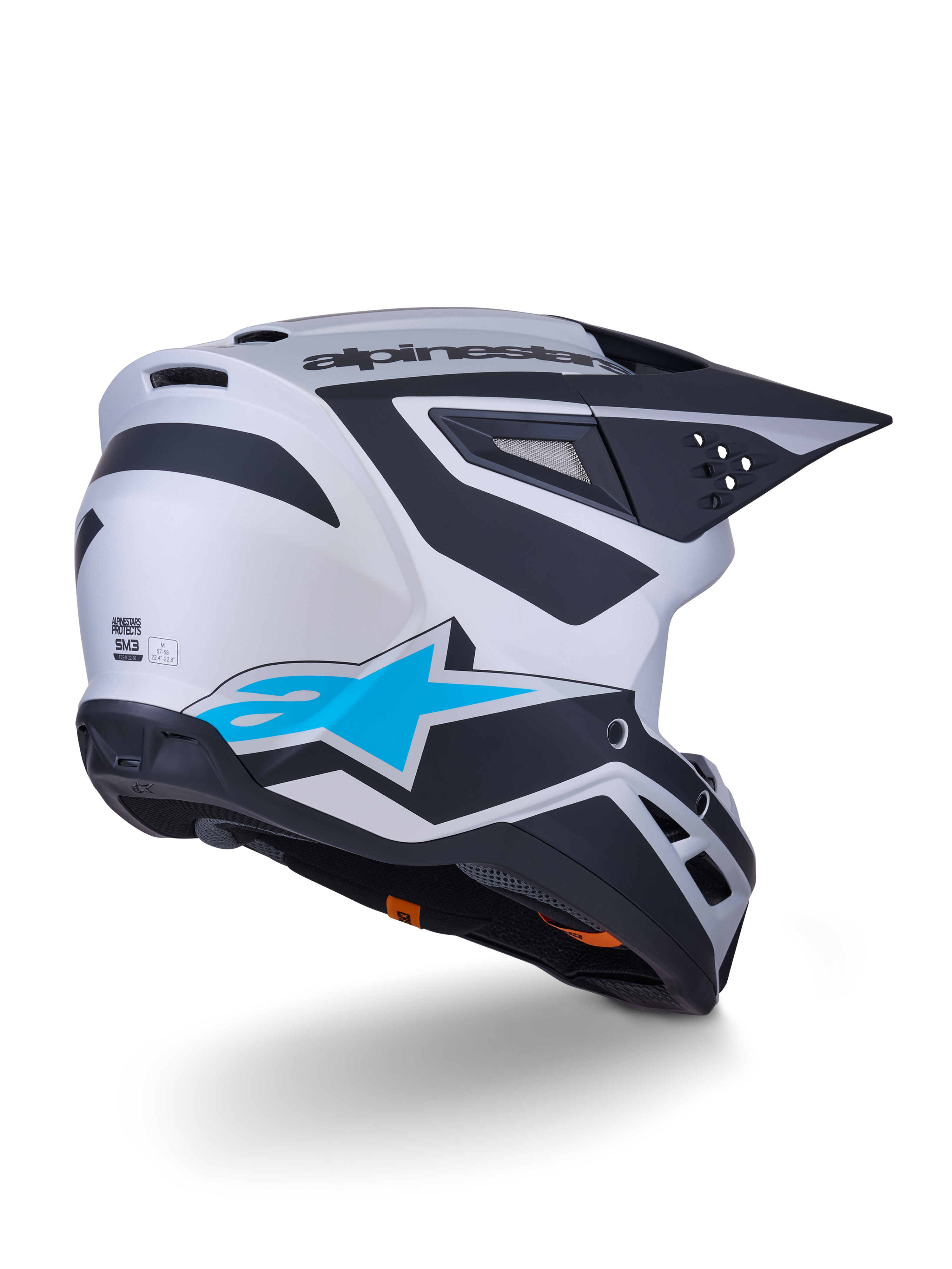 Alpinestars S-M3 Heat Helmet ECE 22.06, casco da motocross, argento, blu e nero opaco, vista posteriore con grande logo a stella blu e motivi angolari neri, calotta aerodinamica con porte di ventilazione, protezione per corse off-road ad alte prestazioni