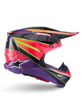 Casco Alpinestars Supertech M10 Era, casco da motocross, rosa, viola e giallo fluo lucido, vista laterale di profilo, caratterizzato da una calotta in carbonio multi-composito con motivi geometrici vivaci, prese d'aria integrate e logo Alpinestars bianco, progettato per prestazioni fuoristrada d'élite.