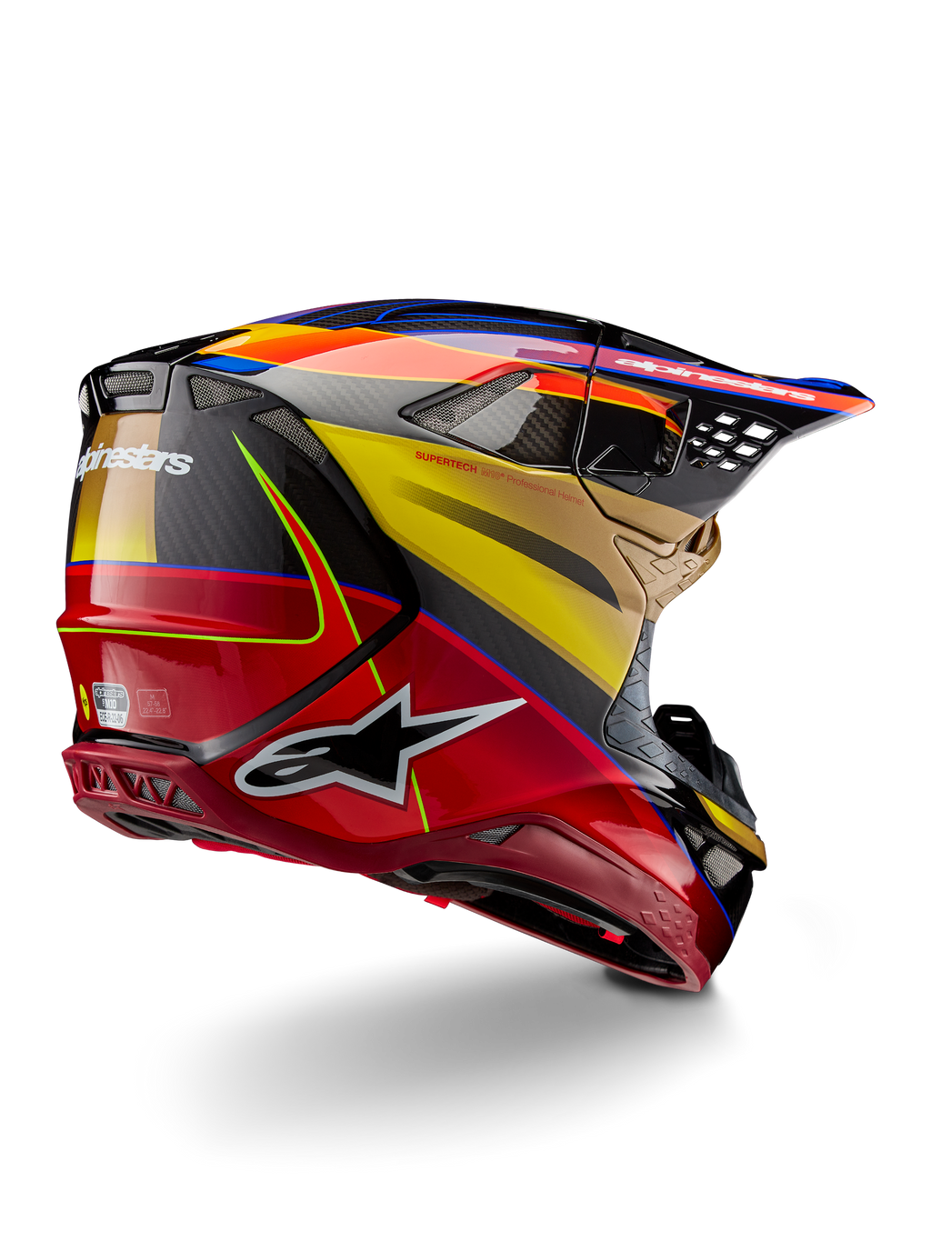 Casco Alpinestars Supertech M10 Era, casco da motocross, Gold Yellow Rio Red lucido, vista posteriore di tre quarti che mostra la calotta in fibra di carbonio con grafiche rosse e gialle, accenti blu, profilo aerodinamico con molteplici prese d'aria e logo Astar in evidenza.